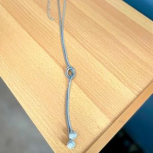 Silver necklace 20 1/2 inches long from clasp to end of the silver balls.